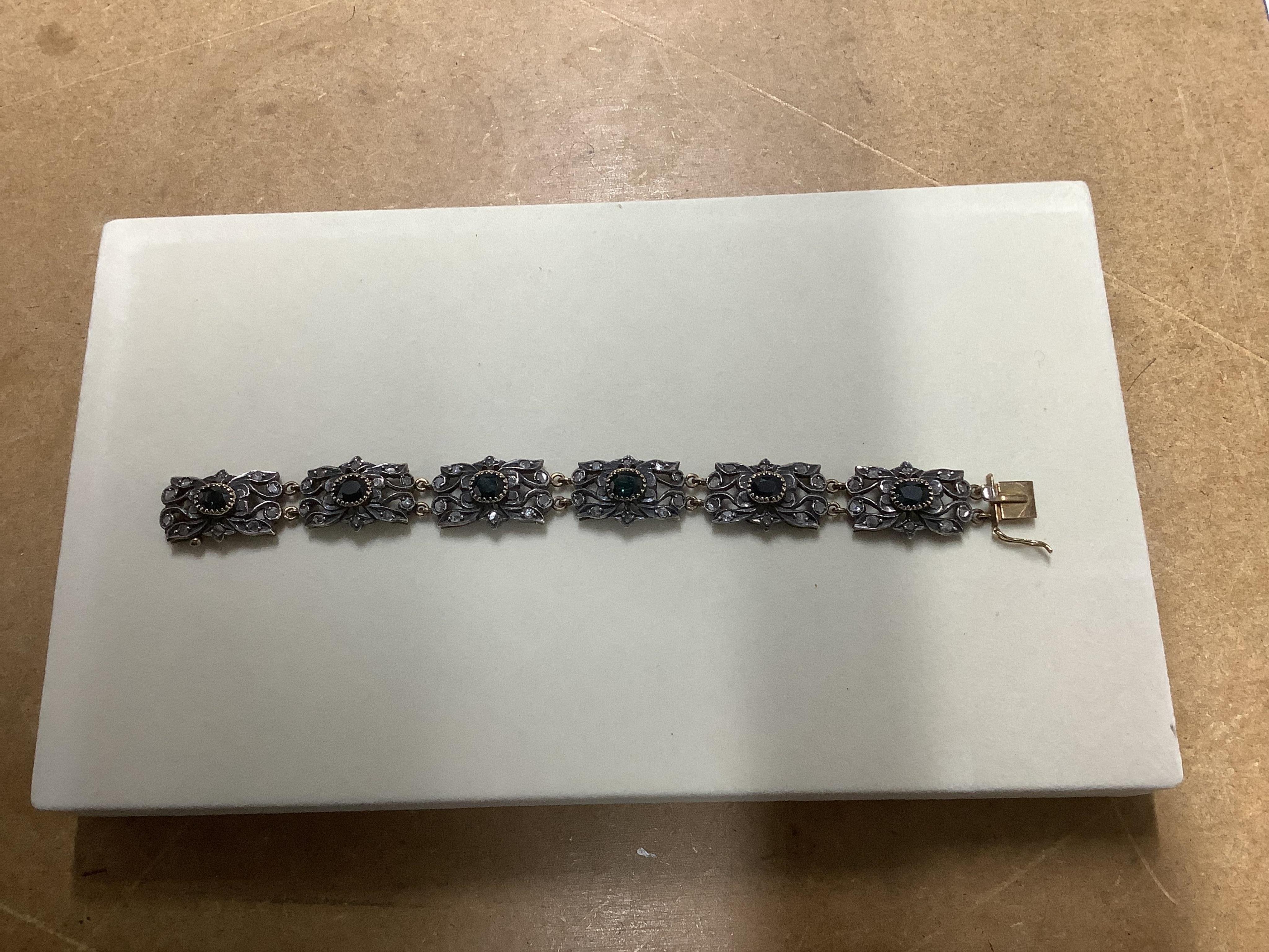 A jewellery case and a collection of jewellery, comprising: an amethyst and peridot pendant in 9ct gold, length 3.8cm, British hallmarks, gross weight approximately 7 grams; a garnet cluster ring in 9ct gold, British hal